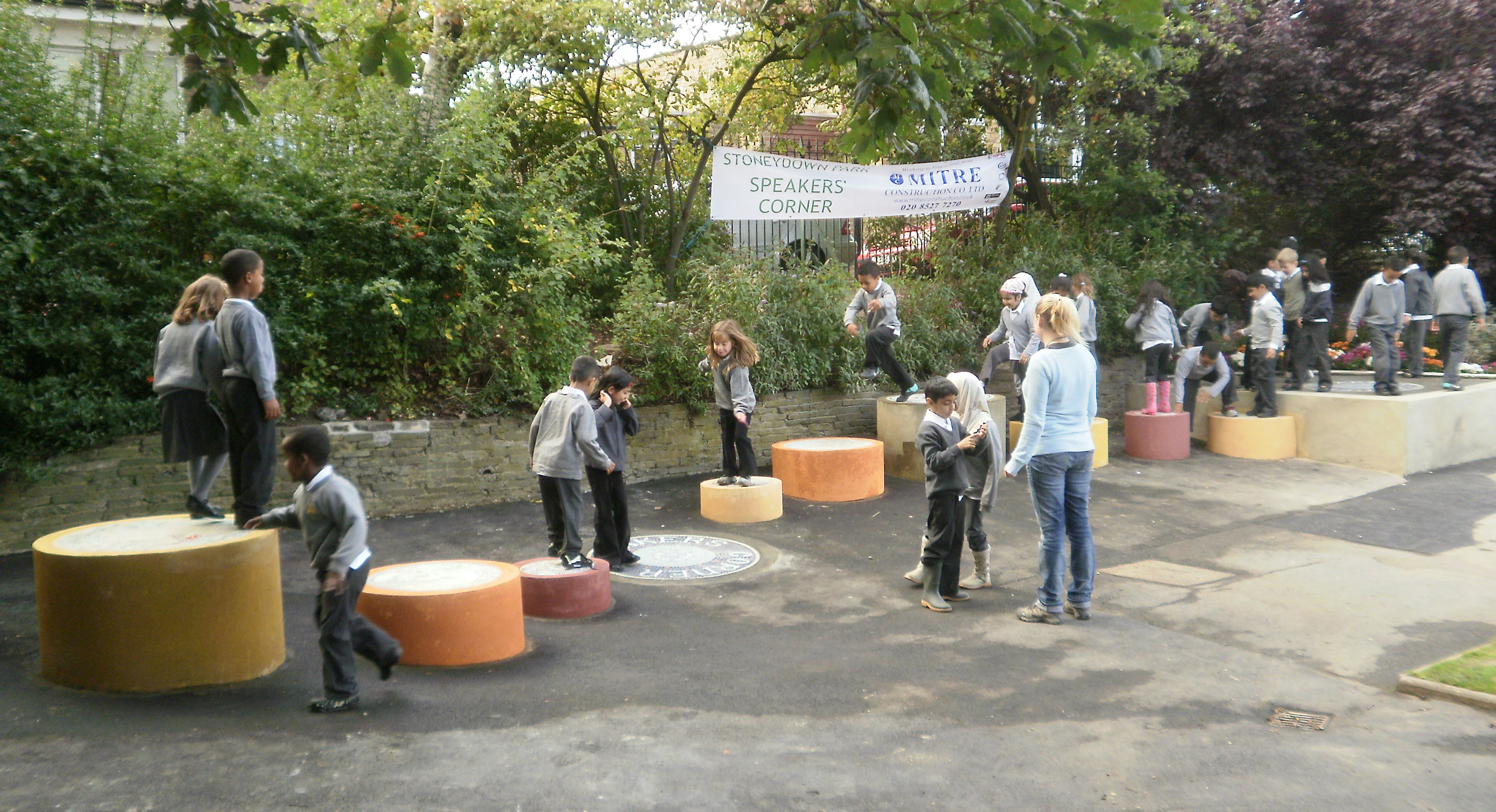 Local children play on the "Stepping Stones" design in Stoneydown Park, London E17.