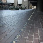 Chalk spray was used to stencil over the existing yellow lines to test the poetry element inserted into the lines.