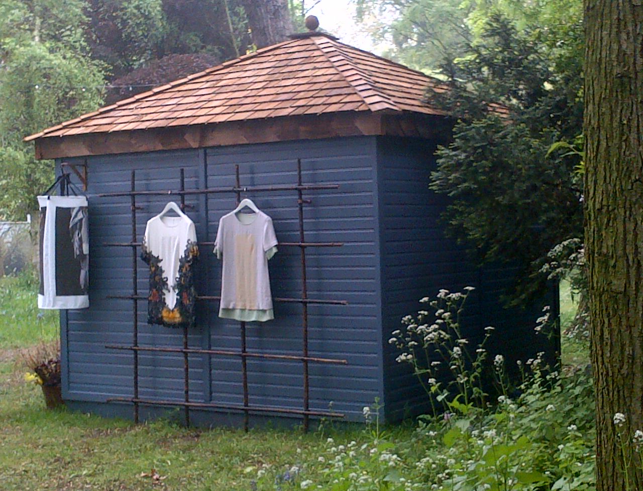 Eco-textile clothes designed by students from the LCF eco-fashion course are displayed outside the Artisan retreat.