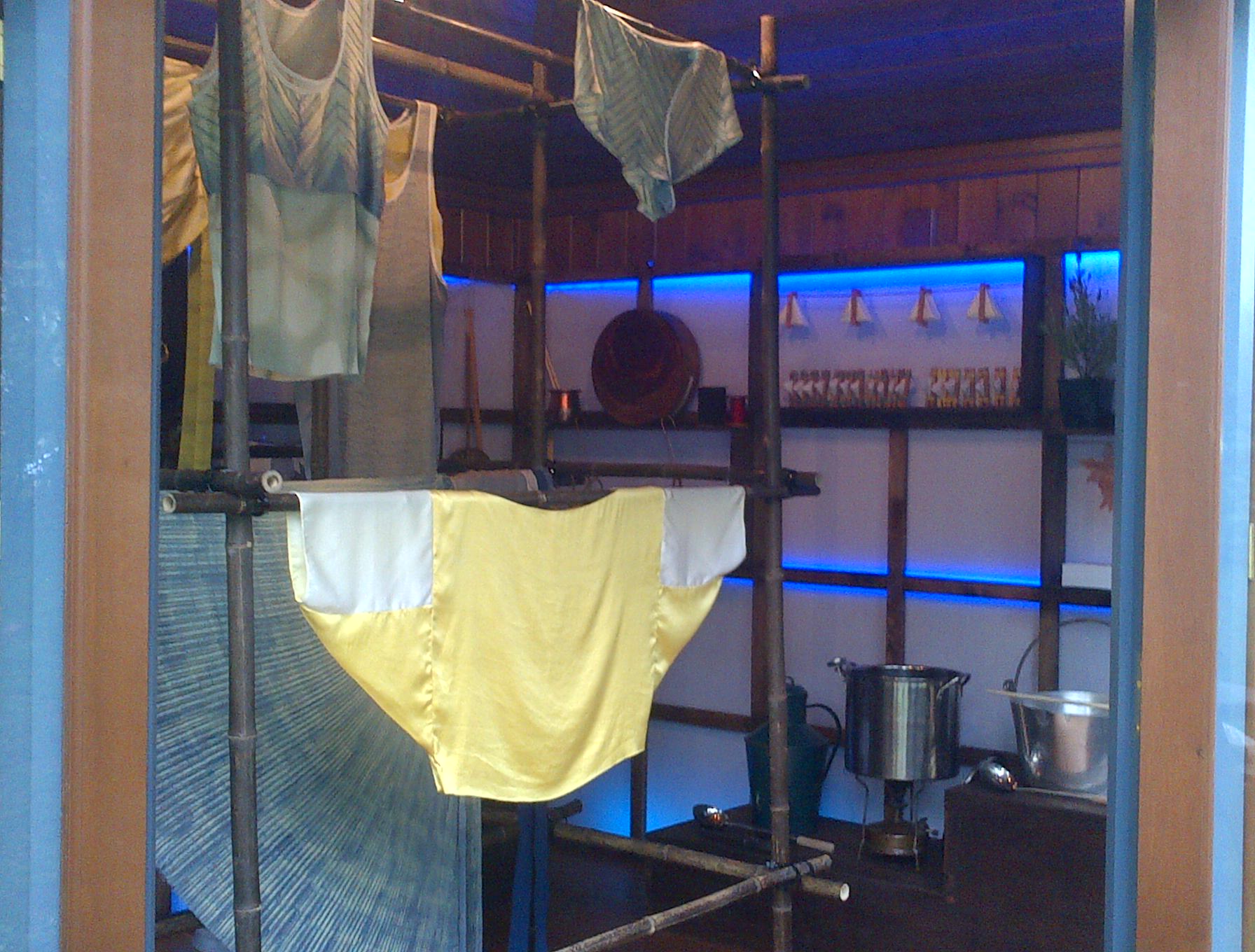 Naturally dyed textiles and clothing design were exhibited in the LCF Artisan Retreat on bamboo poles.